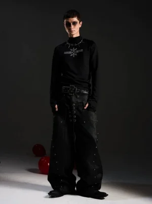 Full body styling of black gothic star mockneck top with punk double belt and studded wide leg streetwear jeans