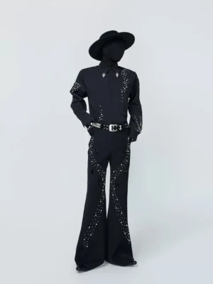 Side three-quarter view of a black gothic streetwear button-down shirt featuring scattered constellation studs on the sleeves and sharp metal collar tips