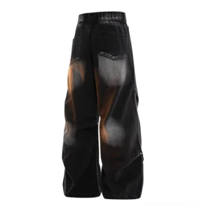 Black gray gradient wash relaxed straight-leg jeans shown from the rear with orange faded denim finish and wide streetwear silhouette