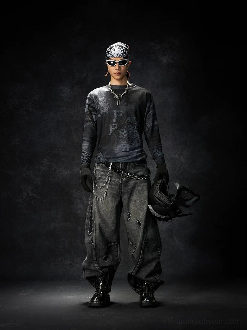 Black and gray washed grunge long sleeve graphic tee shown from an alternate front angle on a punk model