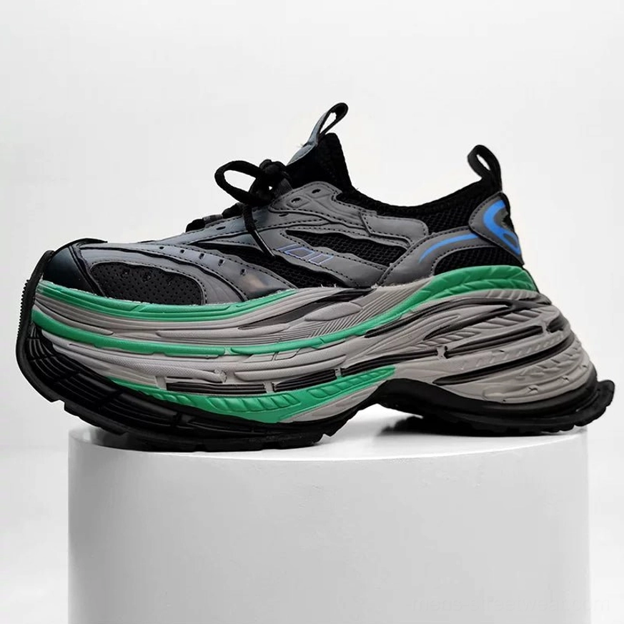 Black grey green and blue color-blocked chunky platform sneakers with functional mesh upper and serrated layered sole