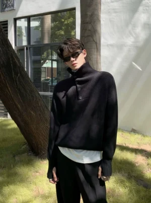 Black half-button ribbed turtleneck sweater styled with a layered white undershirt on a male model in a Seoul-inspired streetwear outfit