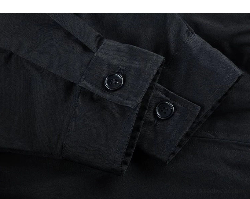 Solid black Harrington jacket cuff close-up featuring two button-adjustable fasteners, clean seams, and a tailored streetwear finish