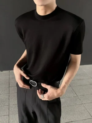 Black heavyweight mock neck T-shirt for men shown in a close front view with a clean minimal fit and leather belt styling