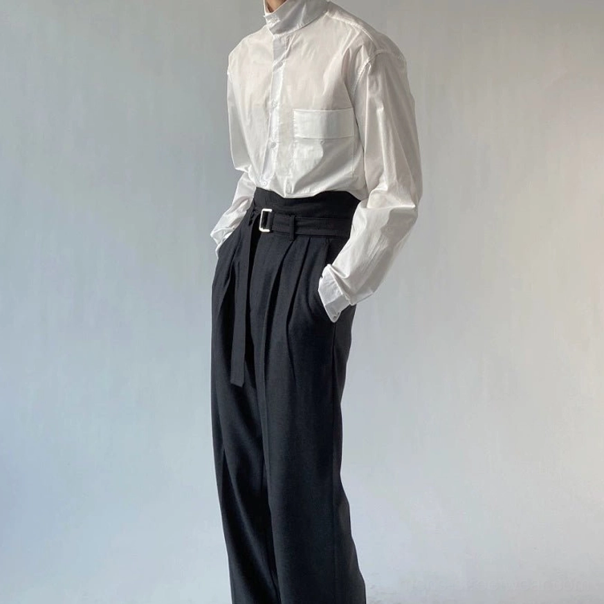Black high-waisted belted wide-leg trousers paired with a crisp white stand-collar shirt for a minimalist Korean fashion look