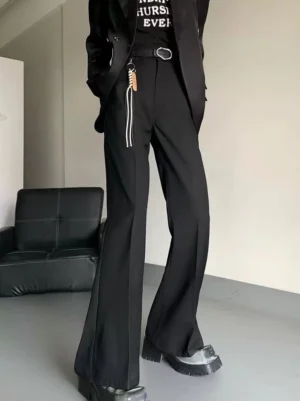 Black high-waisted flared suit trousers styled with a blazer graphic tee and chunky platform shoes in a Korean streetwear outfit