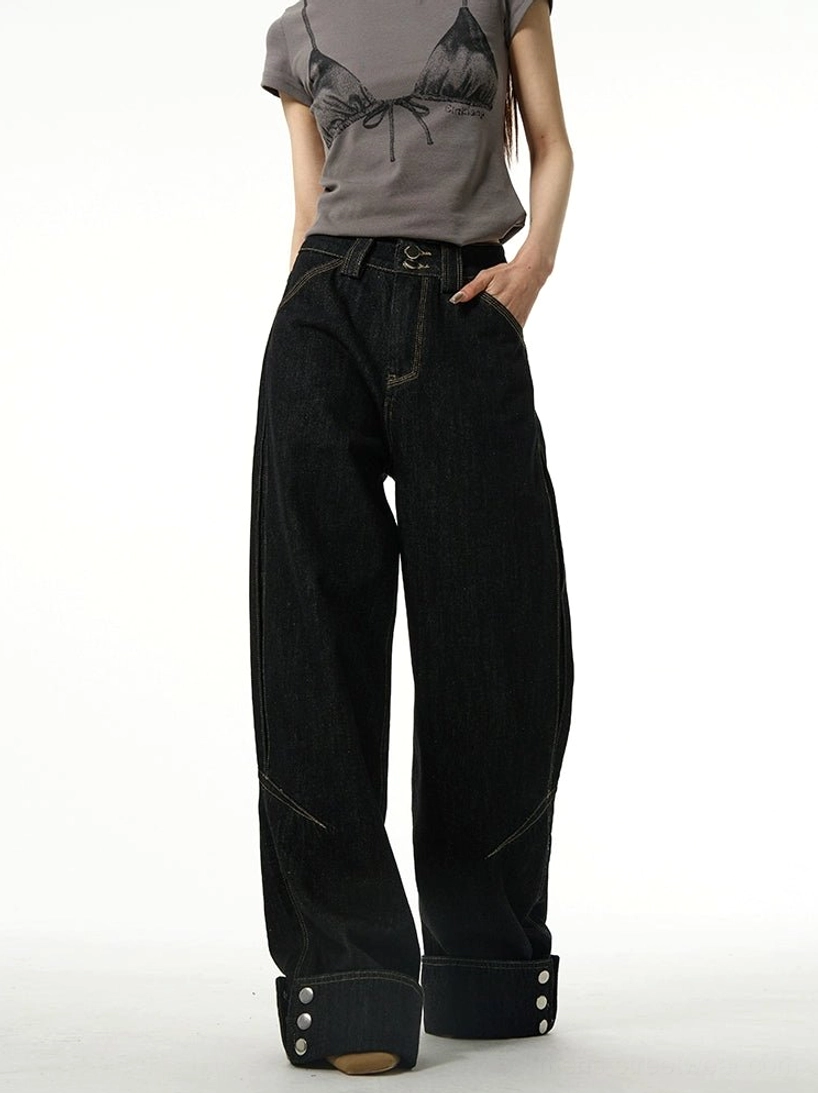 Front full-body view of black high-waisted wide-leg jeans with rolled cuffs, classic belt loops, visible leg seams, and relaxed Seoul streetwear styling