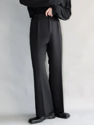 Black high-waisted wide straight-leg suit trousers with fluid tailored drape shown in three-quarter front view