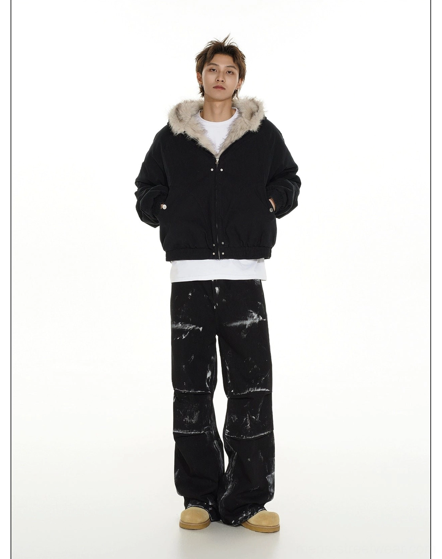 Black hooded cropped bomber jacket shown from the rear with a clean minimalist back and elasticated hem