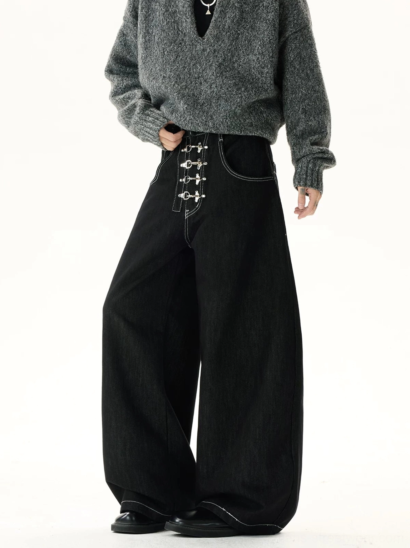 Front and side view of black hook-and-eye corset wide-leg jeans with silver metal closures, contrast stitching, high waist, and oversized streetwear silhouette