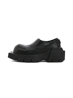 Black horn-detail leather platform derby shoes shown in left side profile with matte cow leather upper and chunky lug sole
