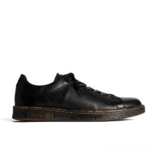 Side profile of black minimalist horsehide derby sneakers with flat laces subtle perforated leather details and distressed brown rubber outsole
