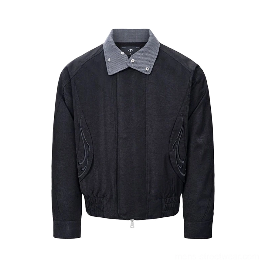 Black cropped bomber jacket with contrast double collar, tonal flame embroidery, zip front, and elasticated hem shown on a white background