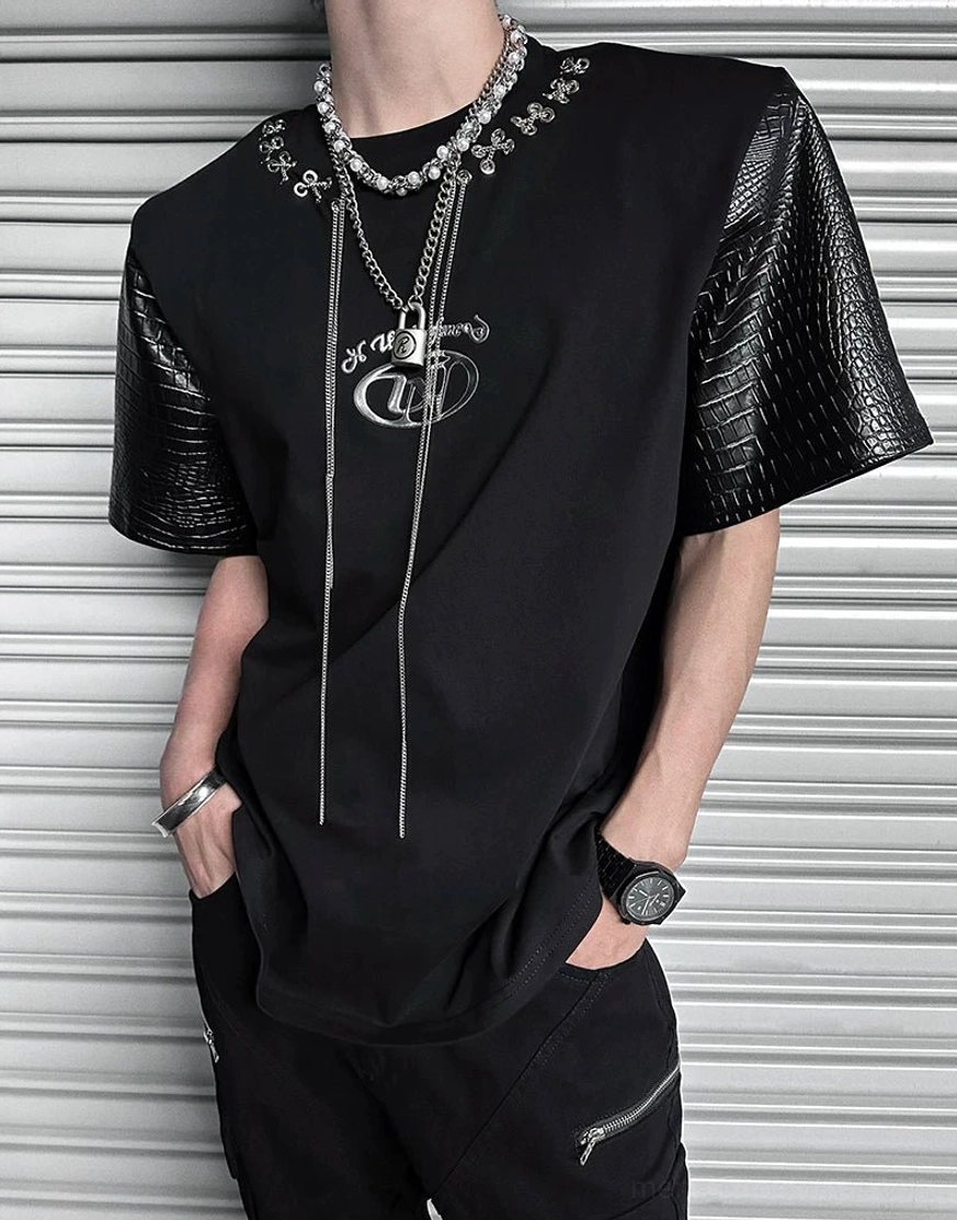 Black Korean fashion T-shirt with textured faux-leather sleeves, draped chain laces, layered jewelry, and industrial streetwear styling