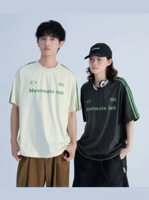 Black Korean streetwear contrast stripe T-shirt shown from the front with green shoulder accents and a minimalist chest graphic