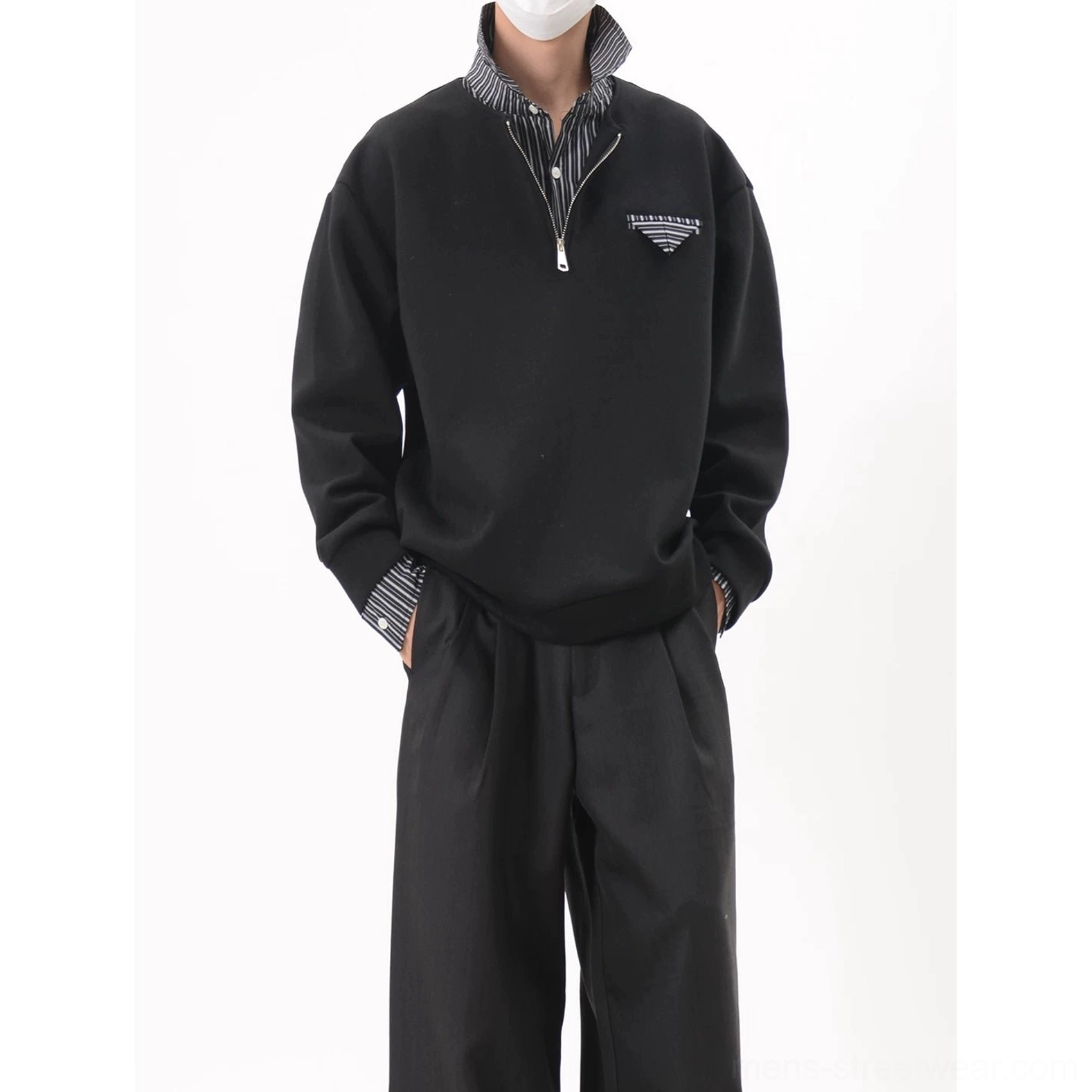 Upper body view of black Korean streetwear half-zip sweatshirt with striped inner collar triangular chest badge and oversized fit