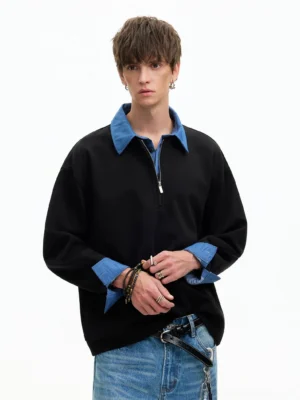 Black Korean streetwear half-zip sweatshirt with blue layered collar and cuffs styled with jeans and belt chain