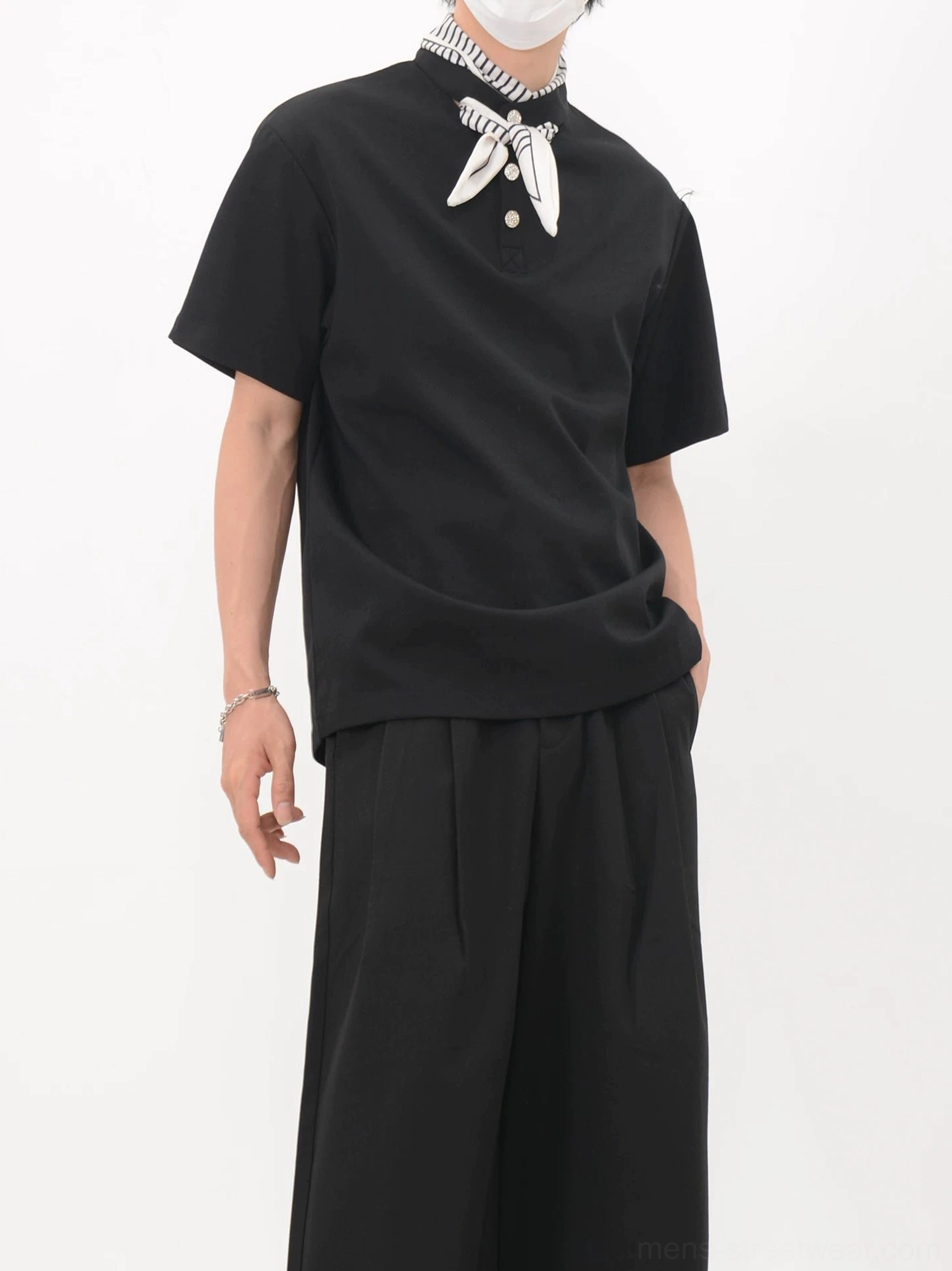 Black Korean streetwear polo tee with bandana scarf collar shown from the right side in a relaxed boxy silhouette