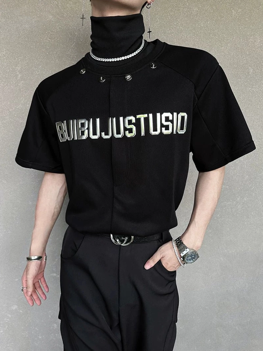 Three-quarter mannequin view of a black Korean streetwear tee with silver chest graphic, high neckline, and layered choker