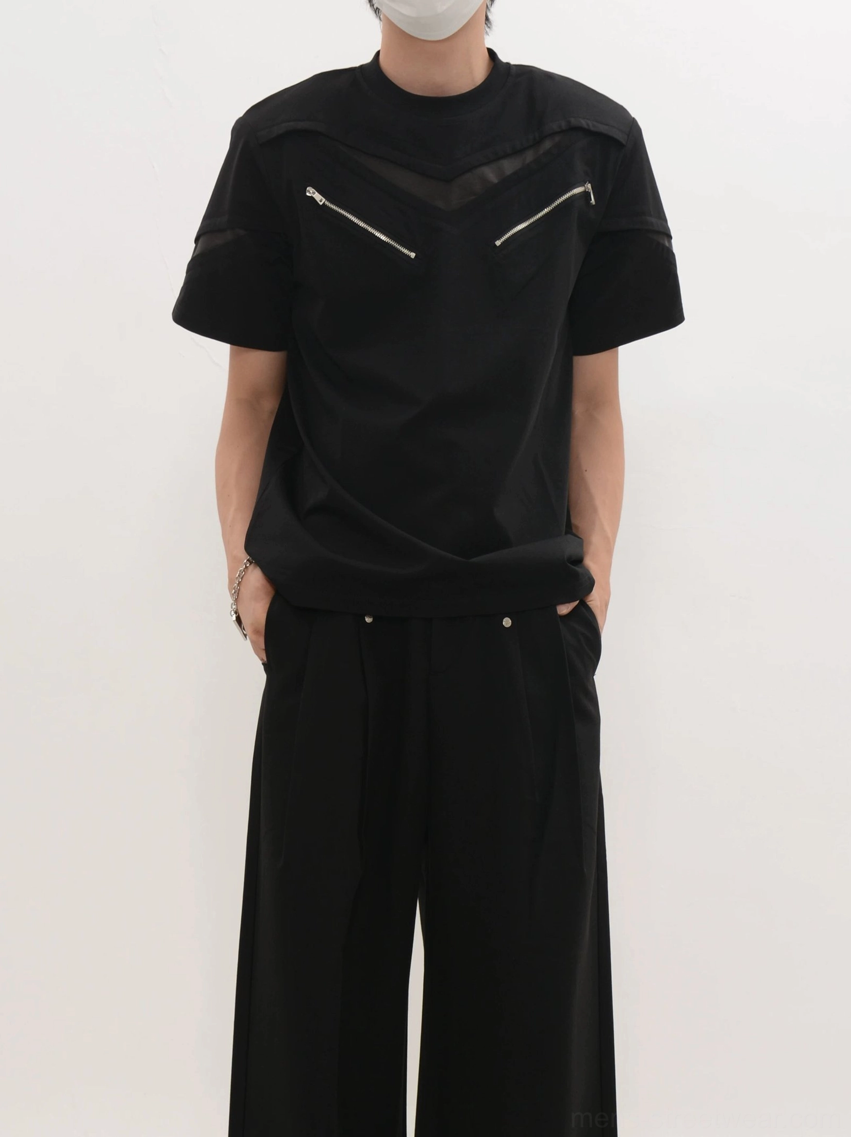 Black Korean techwear T-shirt with mesh shoulder panels and dual zippered utility chest details front view