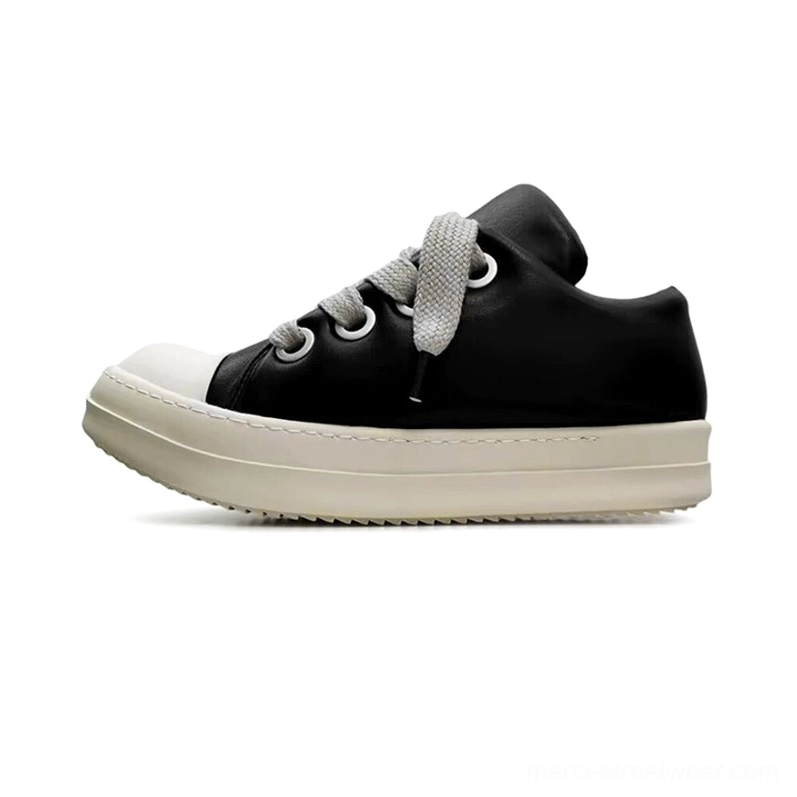 Studio side profile of black lace-up platform sneakers with a rounded off-white toe cap, matching thick sole, and minimalist Korean streetwear design