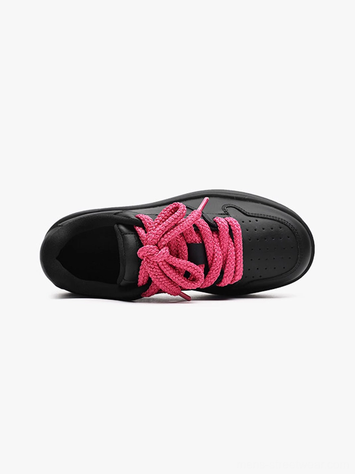Top down flat lay of black lace up platform sneakers showing perforated toe cap pink laces and chunky sole
