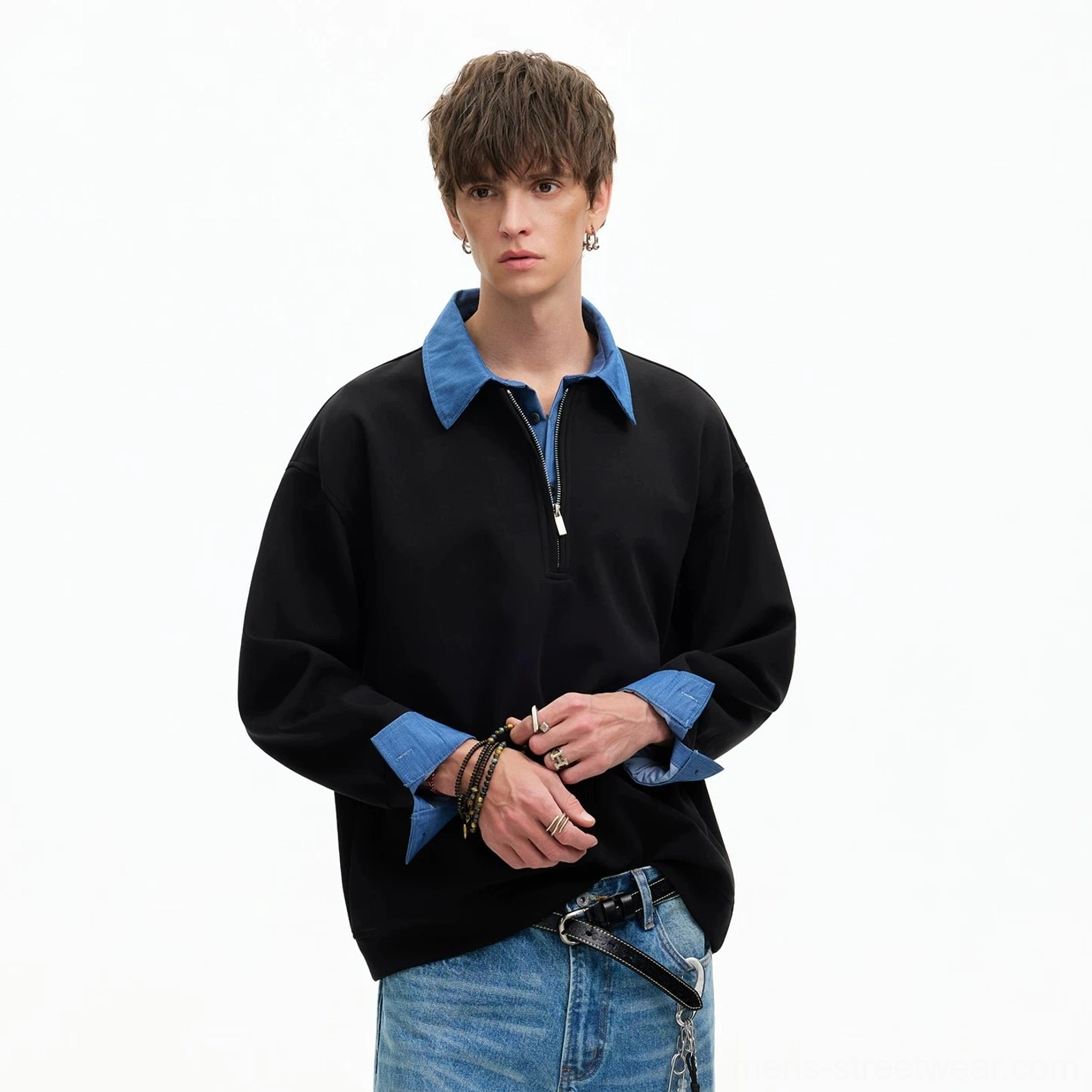 Black layered collar half-zip sweatshirt with blue contrast details styled with jeans and streetwear belt chain