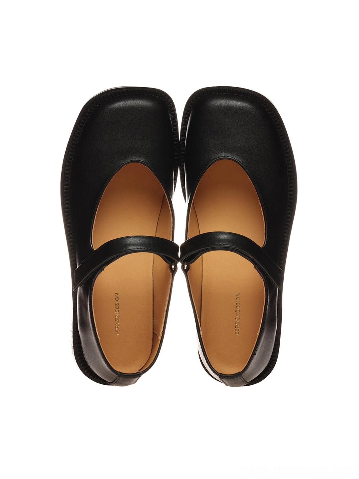 Front flat lay of black leather Mary Jane shoes showing the square toe, single adjustable strap, smooth upper, and tan insoles on a white background