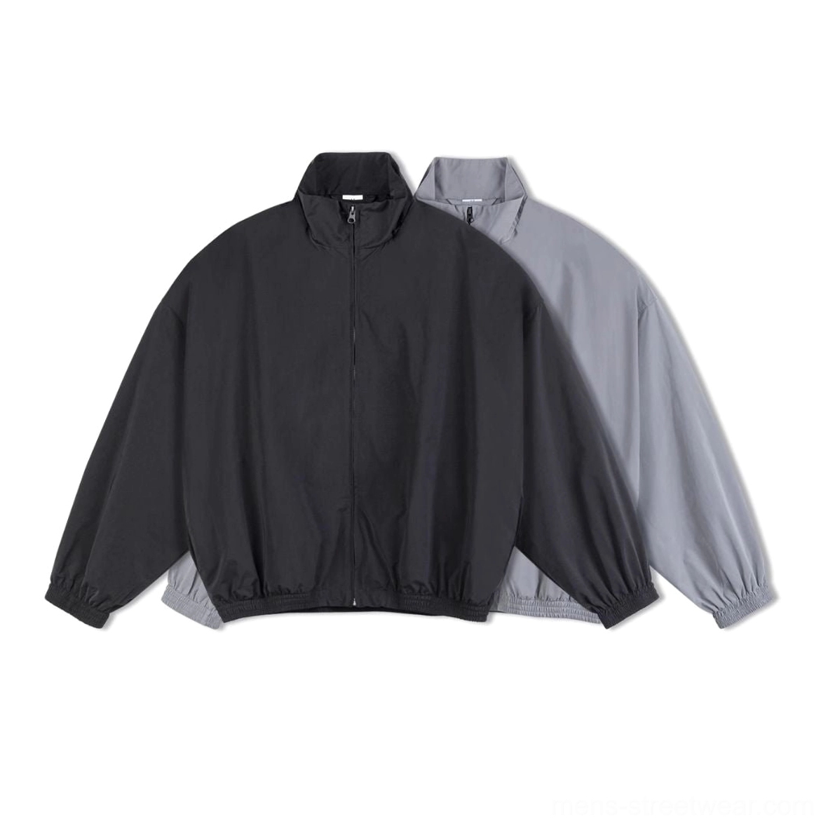 Black and light gray oversized mesh-lined windbreaker jackets shown together in minimalist streetwear color options