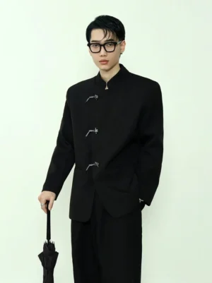 Black mandarin collar toggle blazer shown from the front three-quarter view on a male model wearing black glasses and holding a closed black umbrella