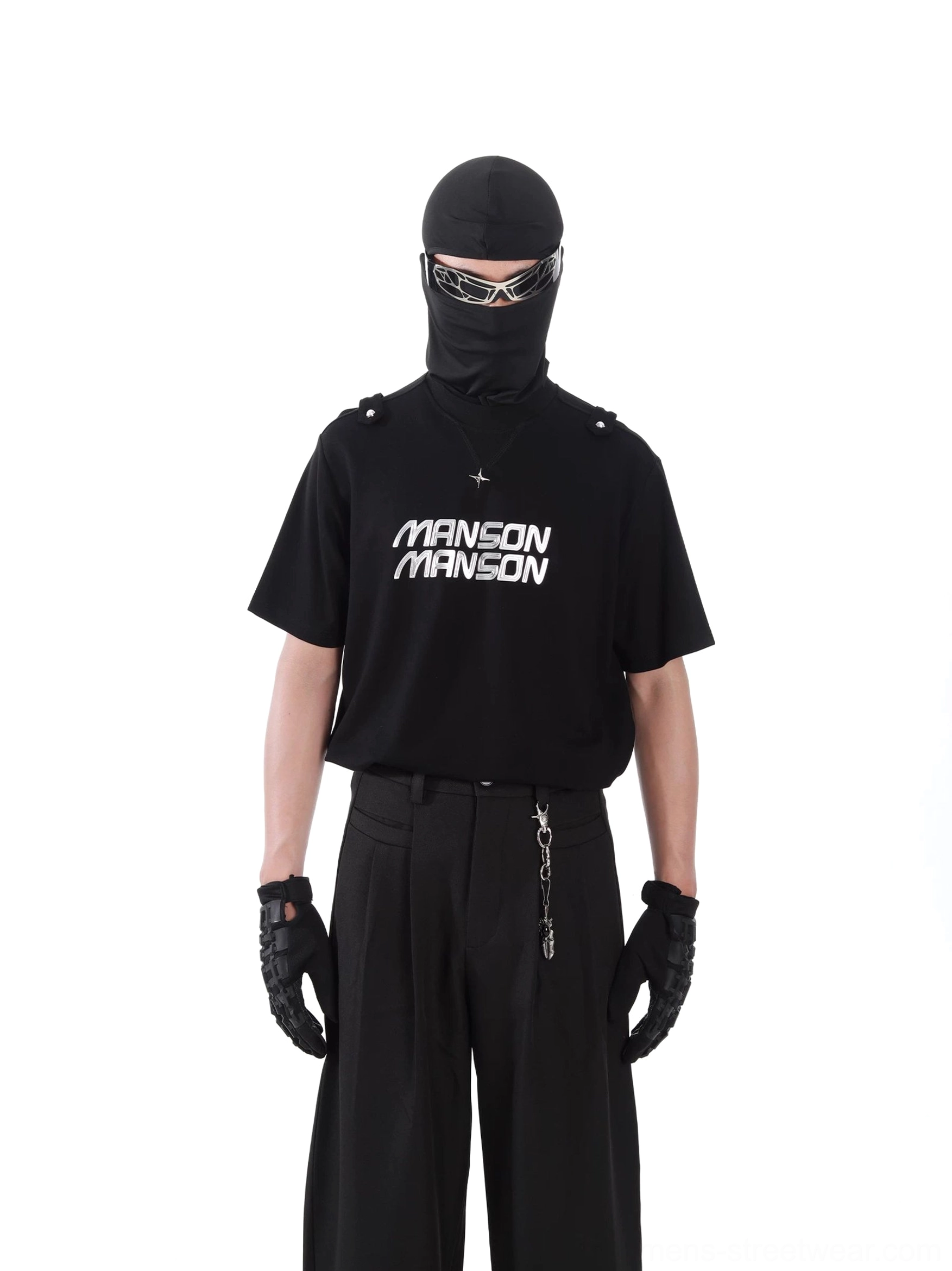 Front view of black MANSON graphic T-shirt in a monochrome Korean techwear outfit with silver necklace, gloves, and futuristic sunglasses