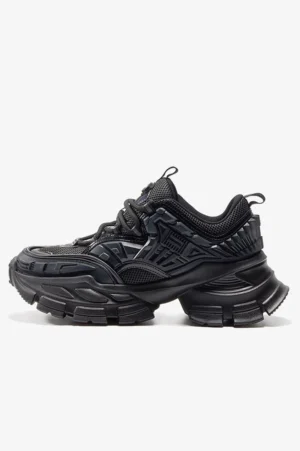 All black mechanical platform sneaker with textured mesh upper structured panels and rugged chunky lug outsole for techwear streetwear