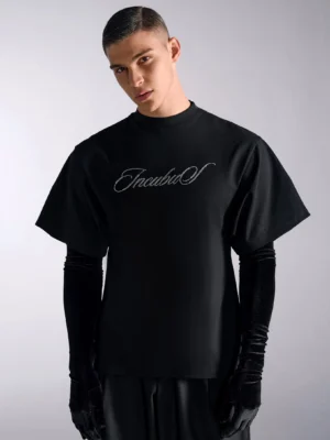 Black men's oversized streetwear T-shirt with silver crystal script chest graphic, layered-look short sleeves, relaxed fit, and wide-leg fashion styling