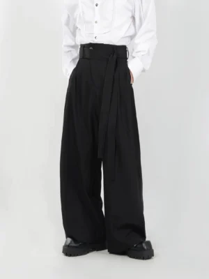 Black mens sash belt pleated wide-leg trousers front full-body view with high waist and floor-skimming straight legs