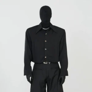 Black metallic button minimalist Korean streetwear shirt shown on mannequin with pointed collar and relaxed long sleeve fit