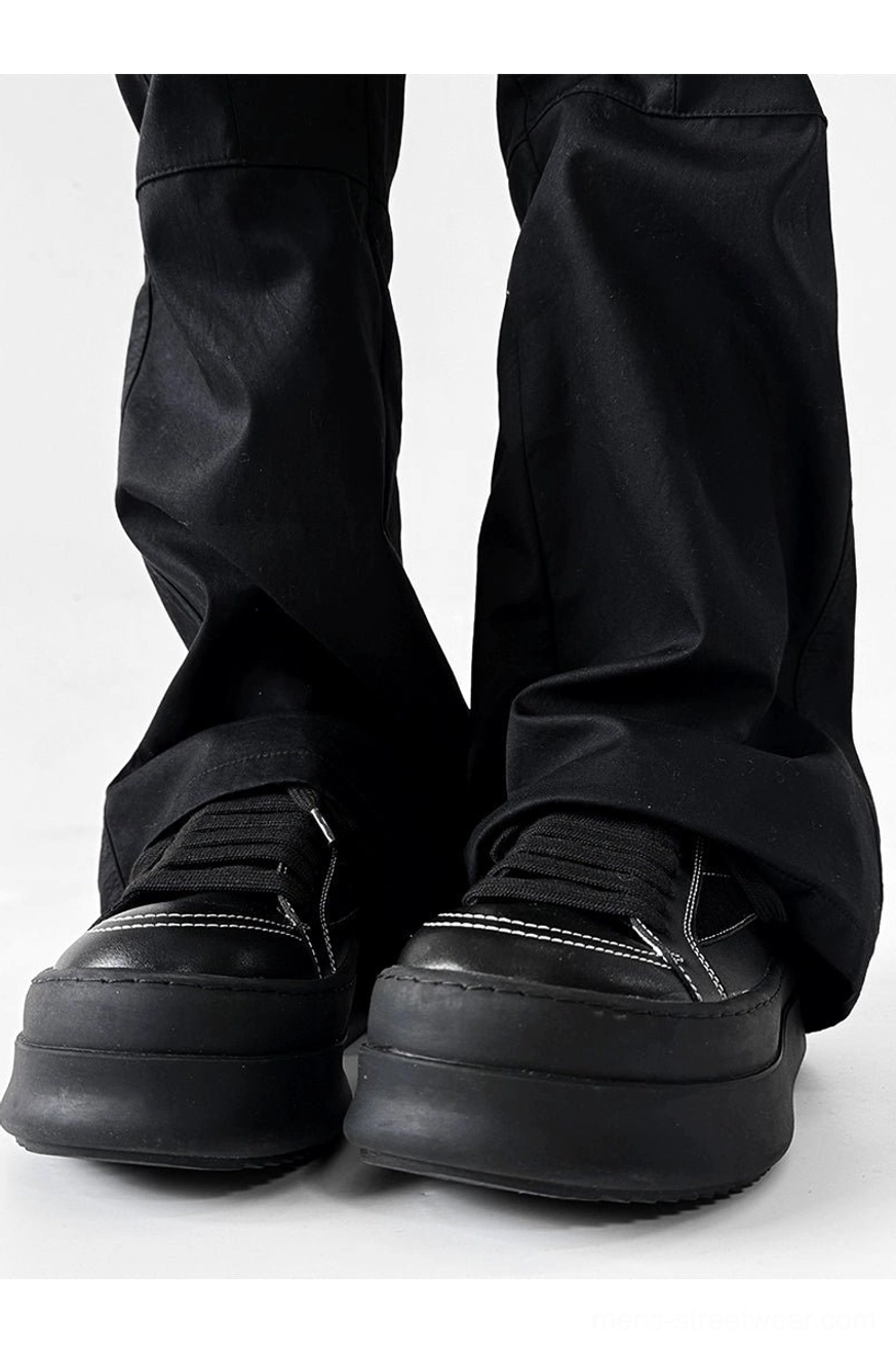 Black microfiber leather platform sneakers with bold streetwear silhouette and thick sole