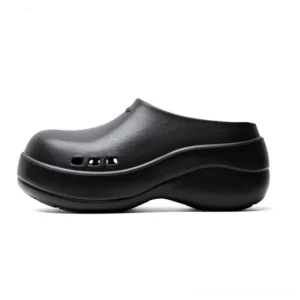 Black Midnight Wave platform clogs with closed rounded toe, three side ventilation holes, chunky curved wedge sole and matte minimalist Korean streetwear design