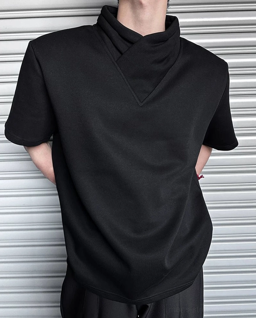 Back three-quarter view of black minimalist mock neck T-shirt with flowy relaxed fit and clean Korean citywear styling