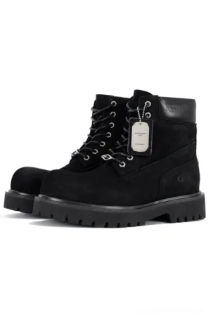 Black nubuck leather classic work boots with silver metal lace hardware, leather hang tag, side zipper, and heavy-duty black lug rubber outsole