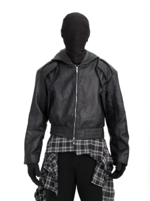 Black hooded faux leather moto jacket front full-body view with boxy silhouette, panel seams, metal zipper, and elasticated hem