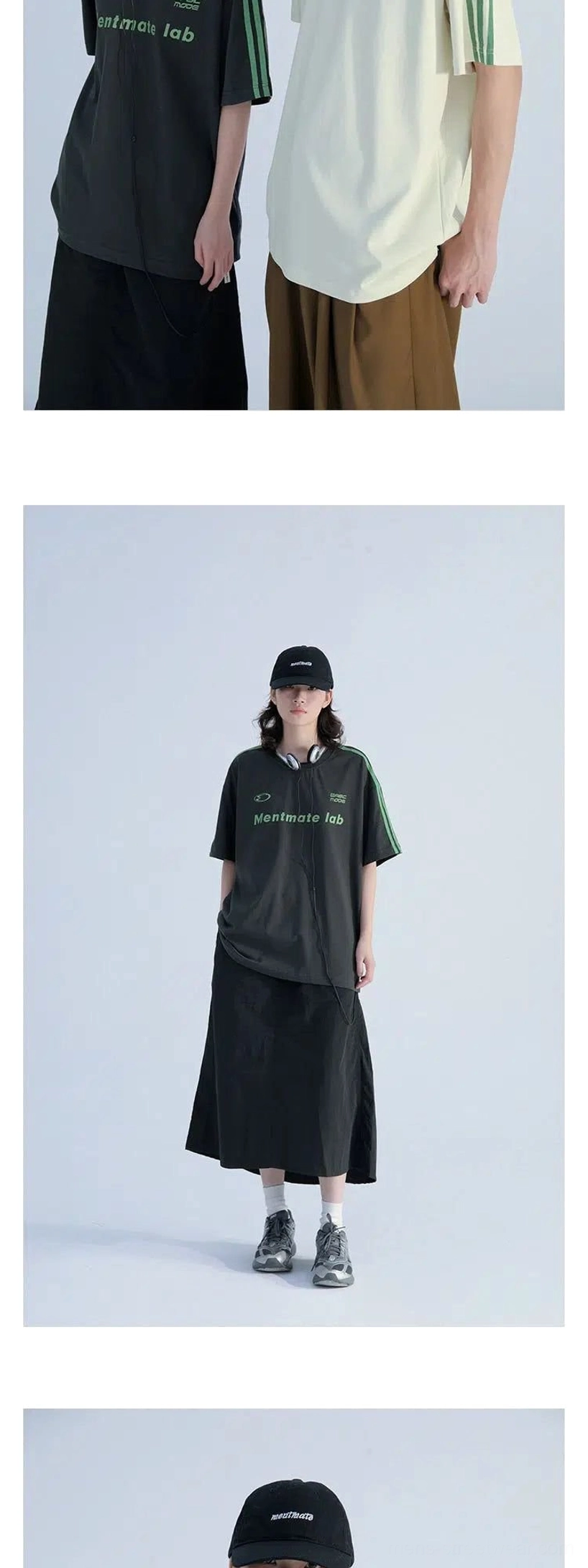 Close-up flat view of black and off white contrast stripe T-shirts with green shoulder detailing and printed chest graphics