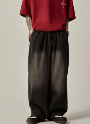 Front view of black ombre fade wide-leg jeans with elasticated waistband and relaxed Korean streetwear fit