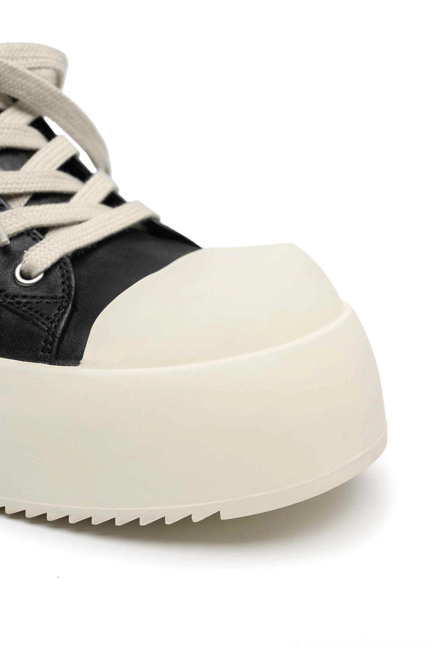 Black Oreo low-top platform streetwear sneakers product detail view with contrasting cream rubber sole