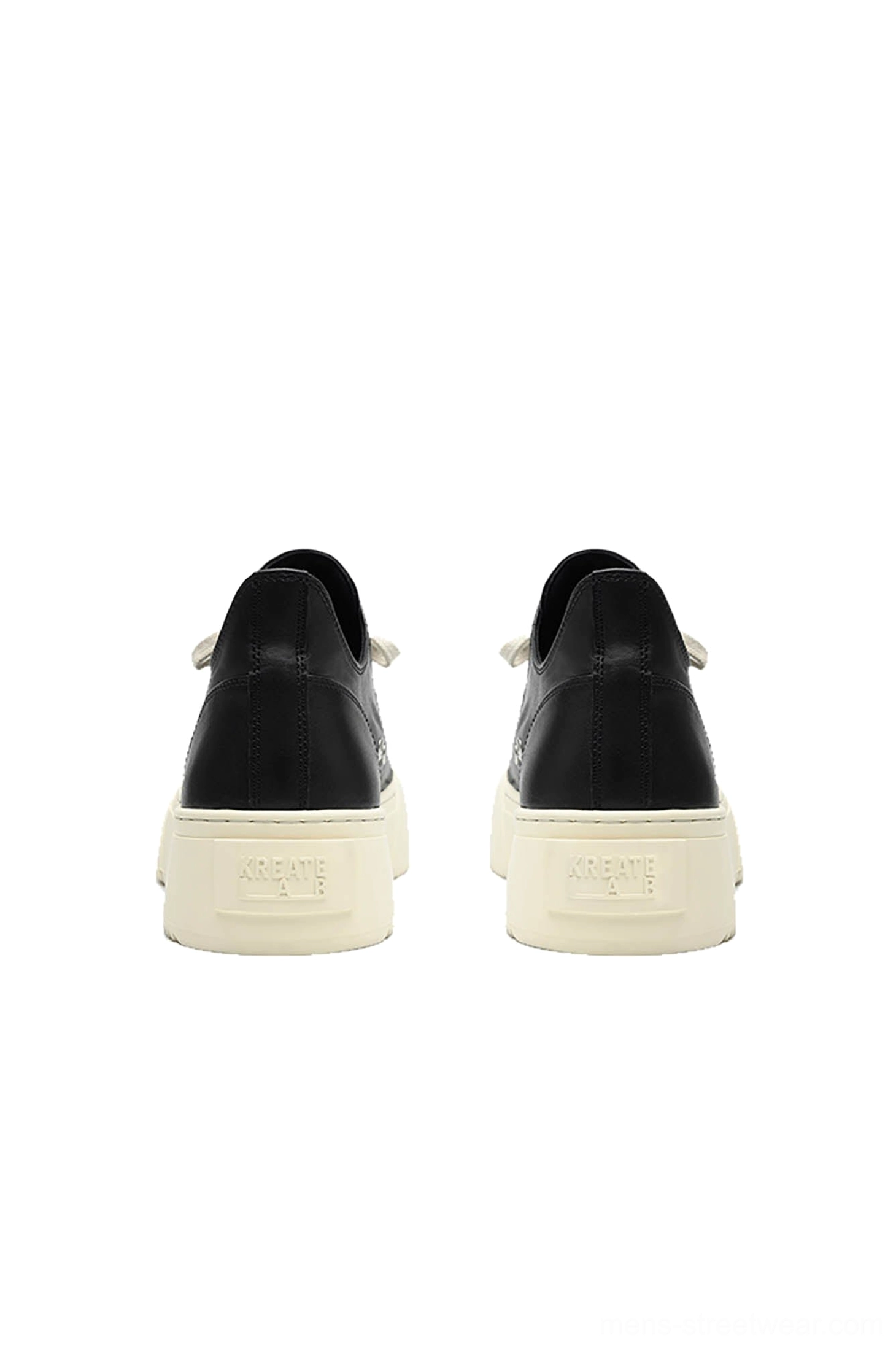 Rear view of Black Oreo low-top platform streetwear sneakers with black heel panels and off-white platform soles