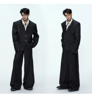 Side views of black oversized blazer and draped wide-leg trousers with printed neck scarf styling