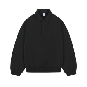 Black oversized cotton long sleeve polo sweatshirt with minimalist half placket collar and ribbed hem