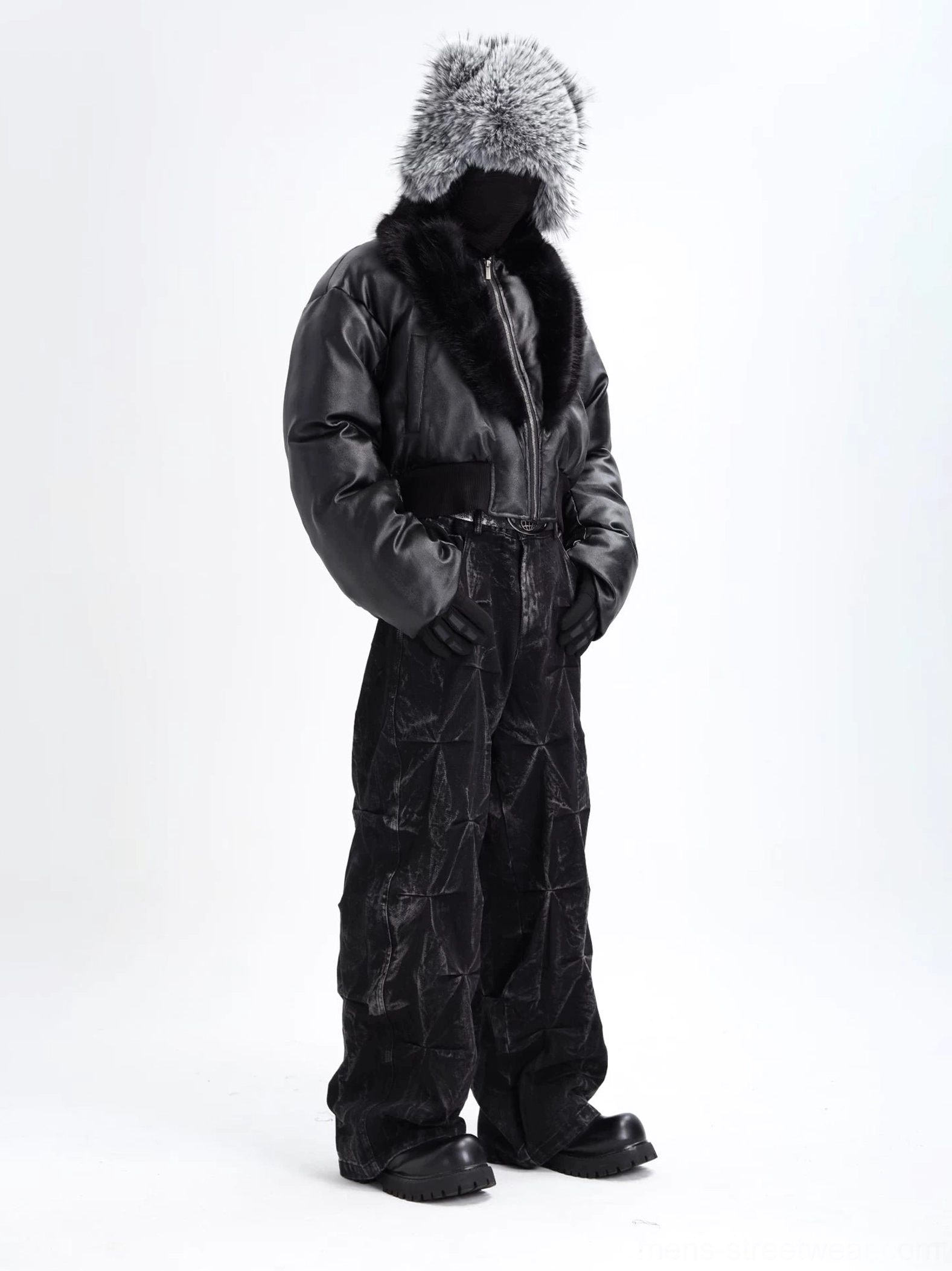 Side view of oversized black cropped puffer jacket with faux fur shawl collar, ribbed cuffs, padded sleeves, and relaxed avant-garde streetwear fit
