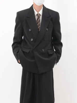 Black oversized double-breasted streetwear blazer with peak lapels and structured shoulders front view