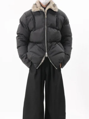 Black oversized quilted puffer jacket with faux fur collar, center zipper closure, relaxed streetwear fit, and wide-leg trousers