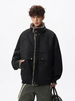 Black oversized faux shearling aviator jacket with high collar and cargo styling for modern streetwear